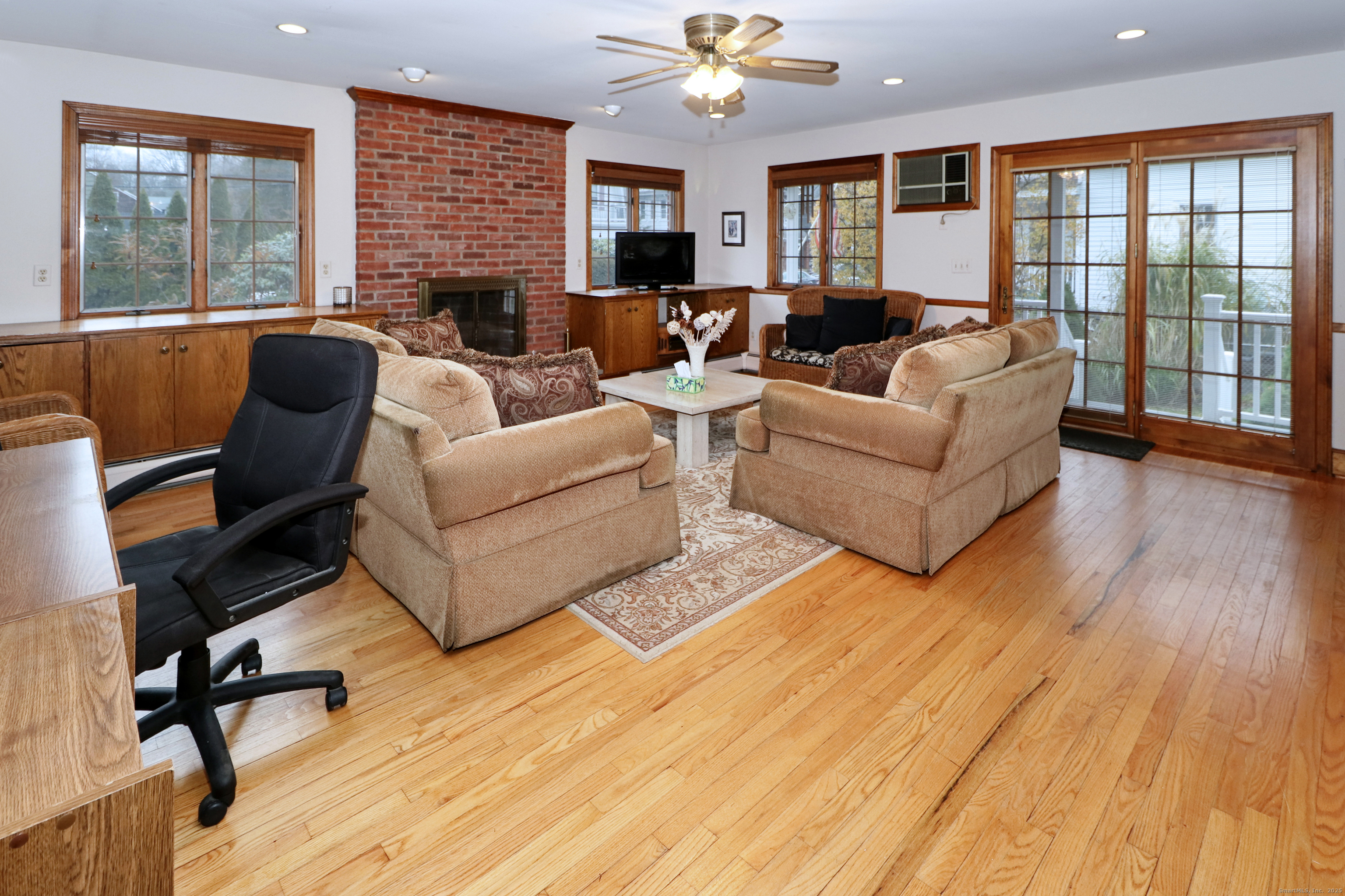 232 Church Hill Road Fairfield, CT 06825 - Photo 15 of 31 a living room with furniture and a wooden floor