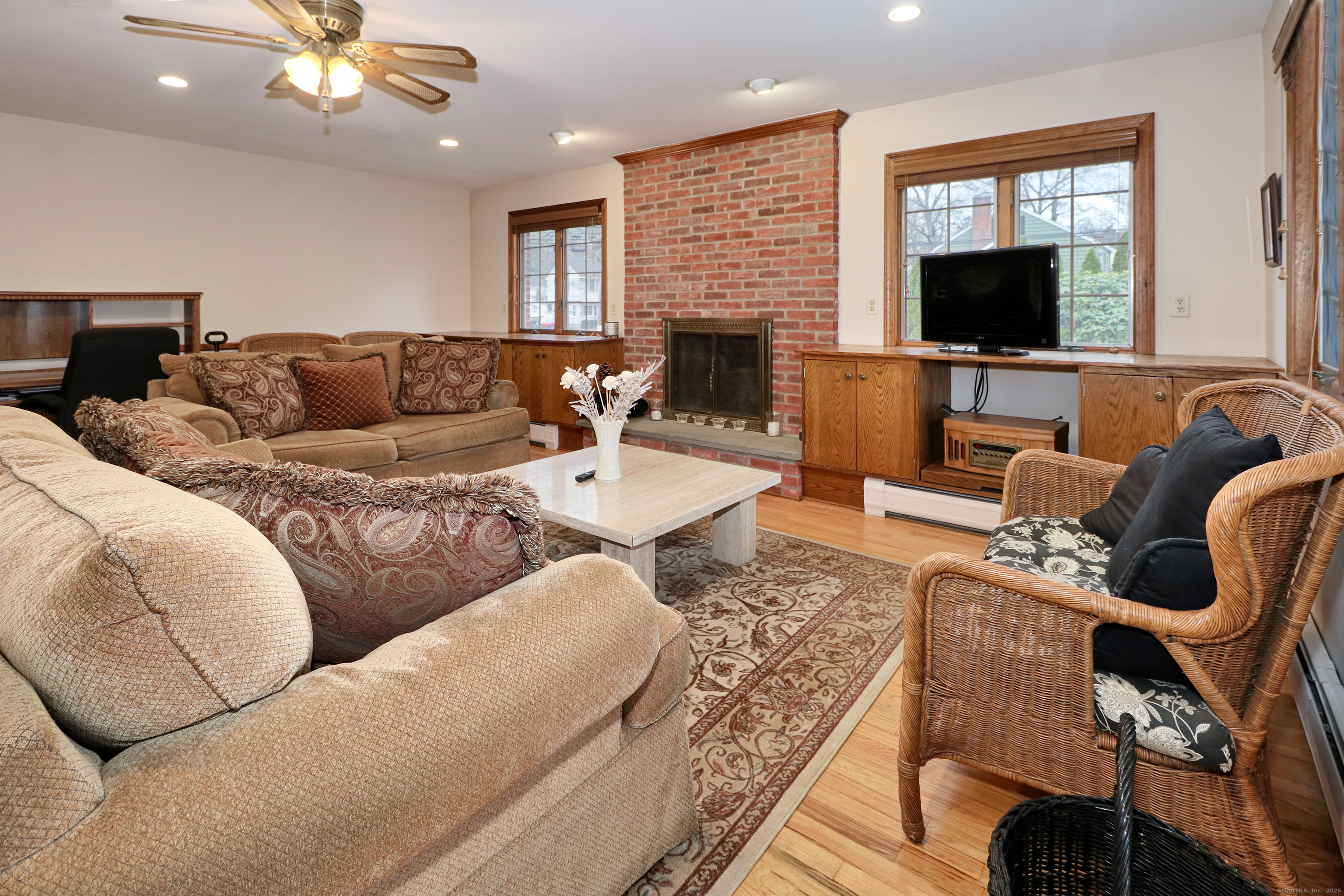 232 Church Hill Road Fairfield, CT 06825 - Photo 17 of 31 a living room with furniture and a flat screen tv