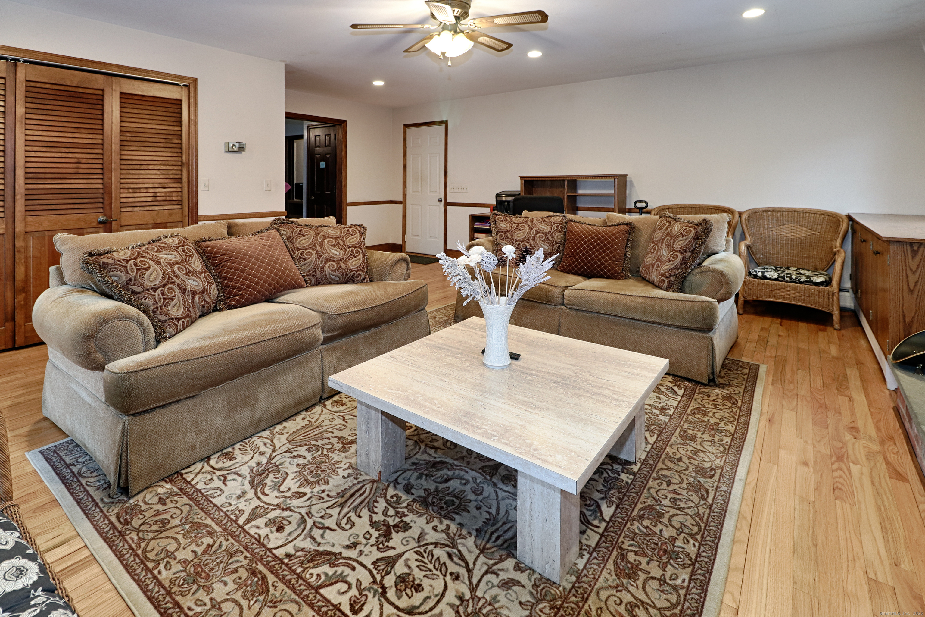 232 Church Hill Road Fairfield, CT 06825 - Photo 18 of 31 a living room with furniture and a rug
