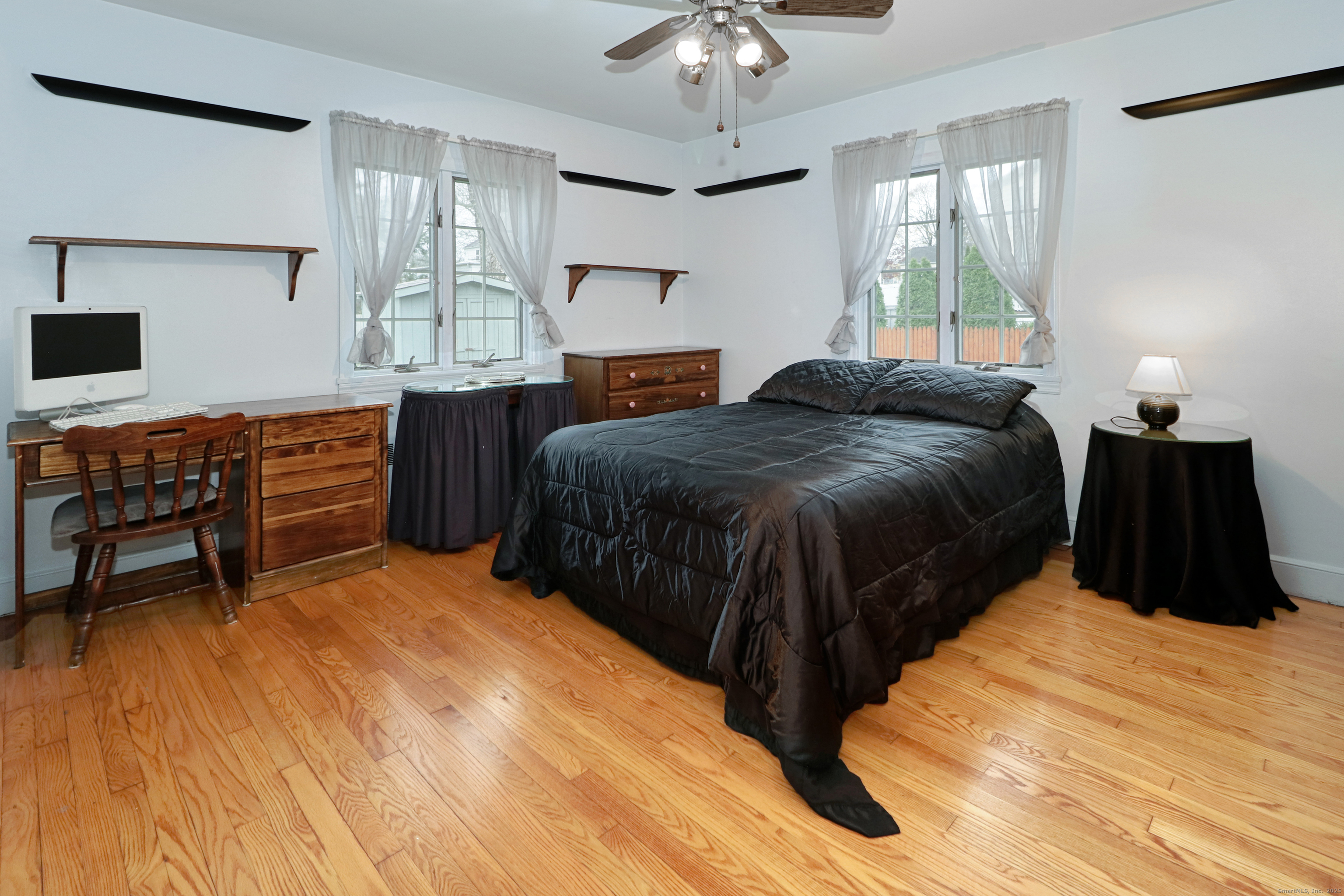 232 Church Hill Road Fairfield, CT 06825 - Photo 19 of 31 a bedroom with a bed and a dresser
