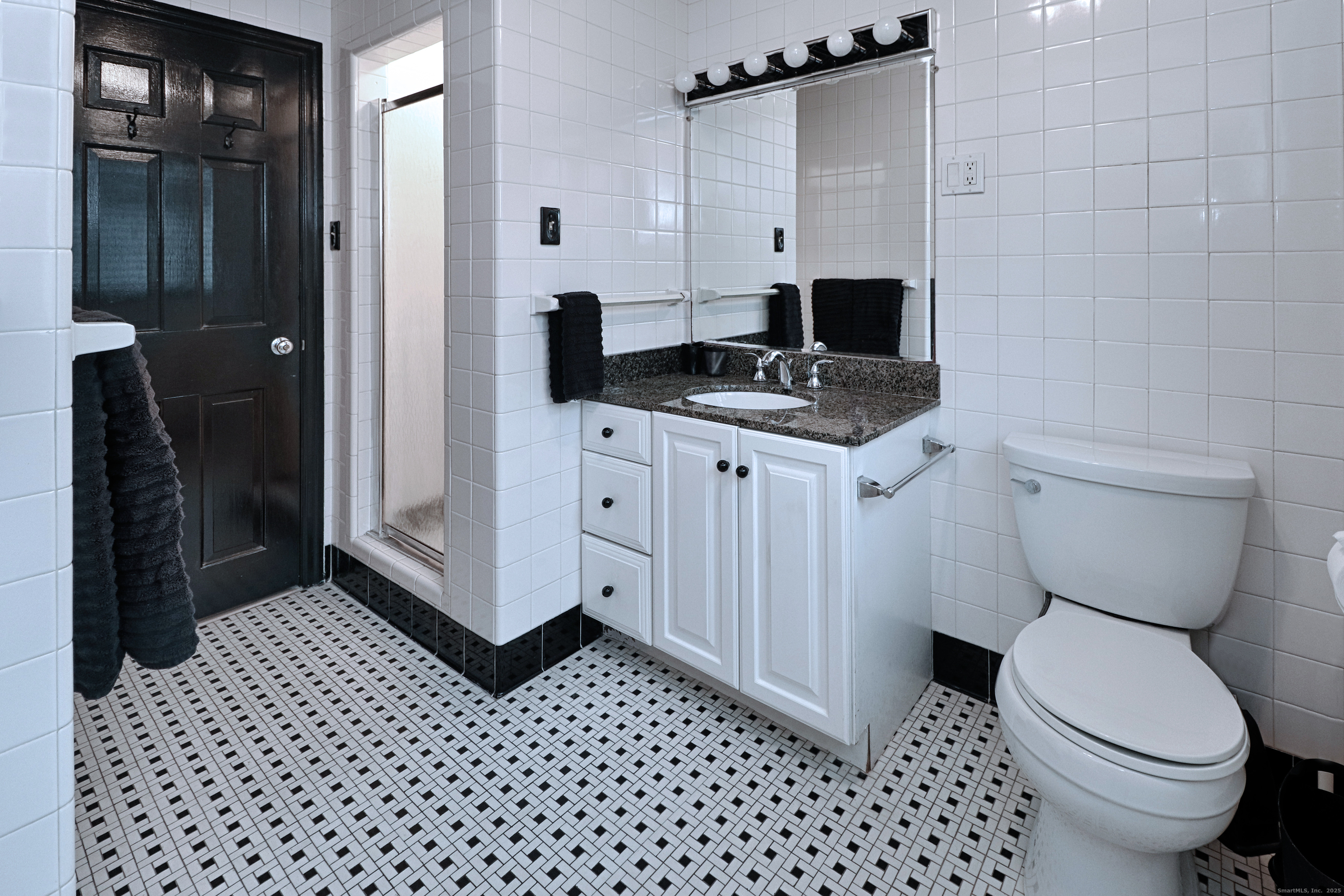 232 Church Hill Road Fairfield, CT 06825 - Photo 20 of 31 a bathroom with a toilet a sink and shower