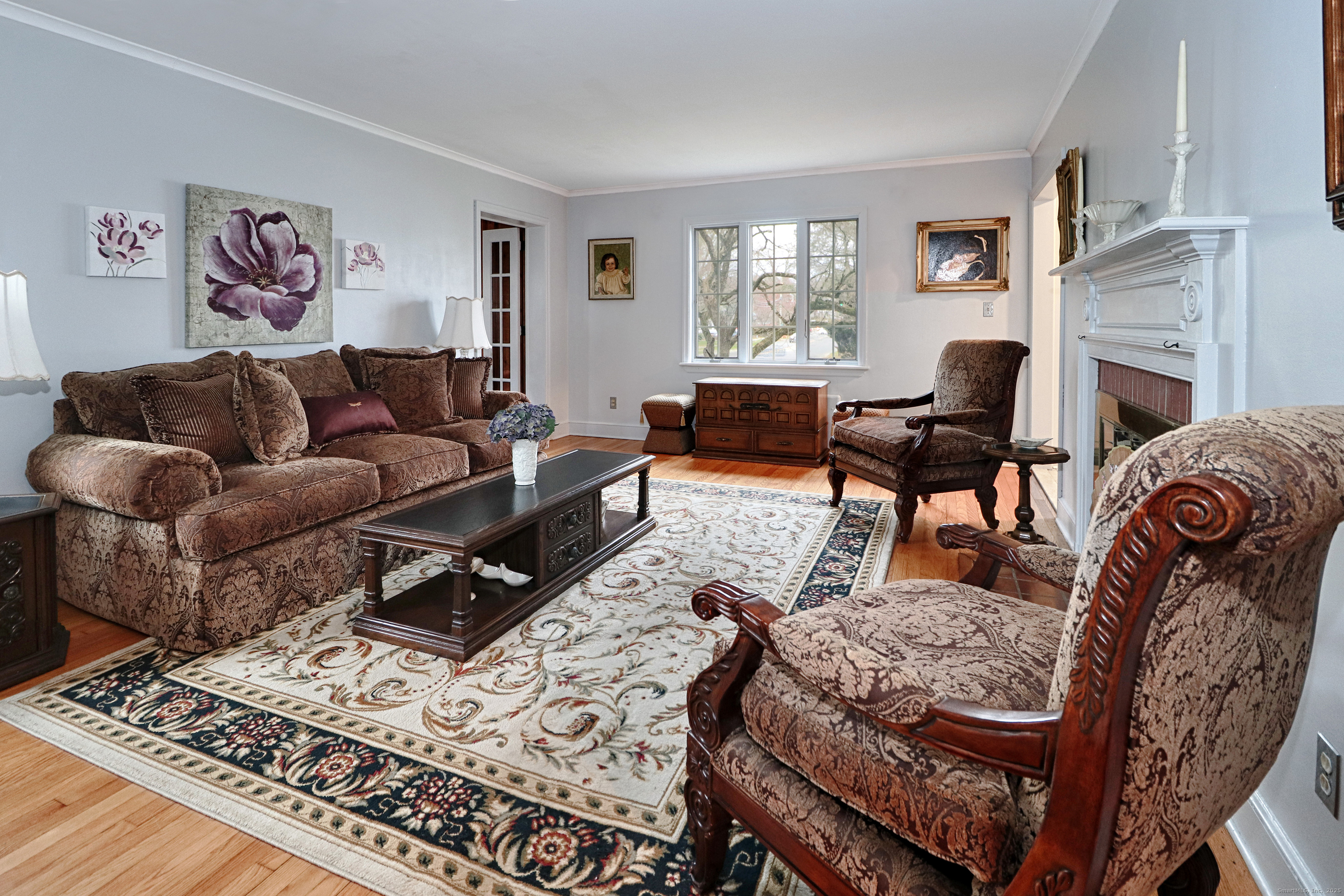 232 Church Hill Road Fairfield, CT 06825 - Photo 6 of 31 a living room with furniture a fireplace and a window