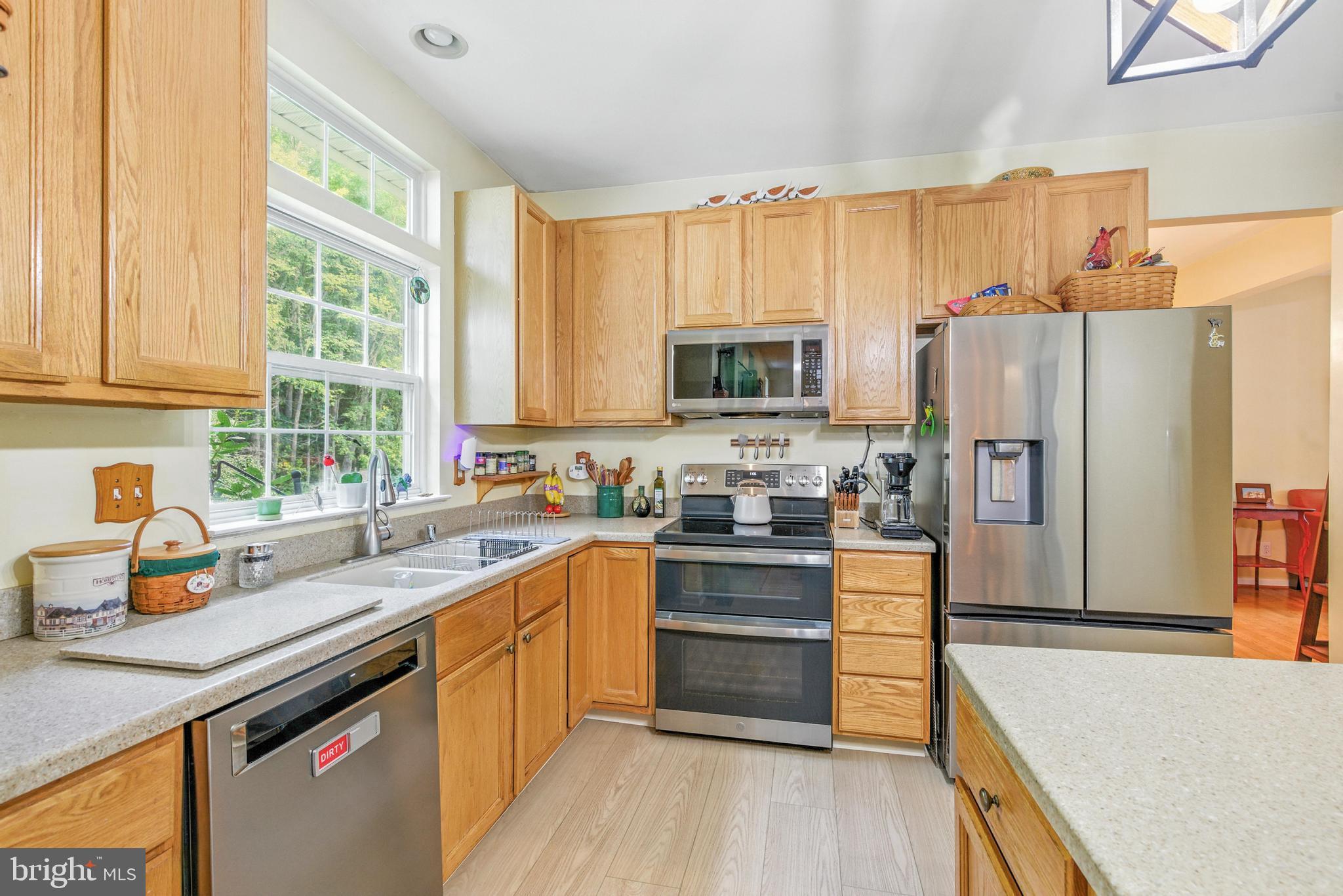 463 Preakness Run Newark, DE 19702 - Photo 11 of 32 a kitchen with stainless steel appliances a refrigerator sink and cabinets