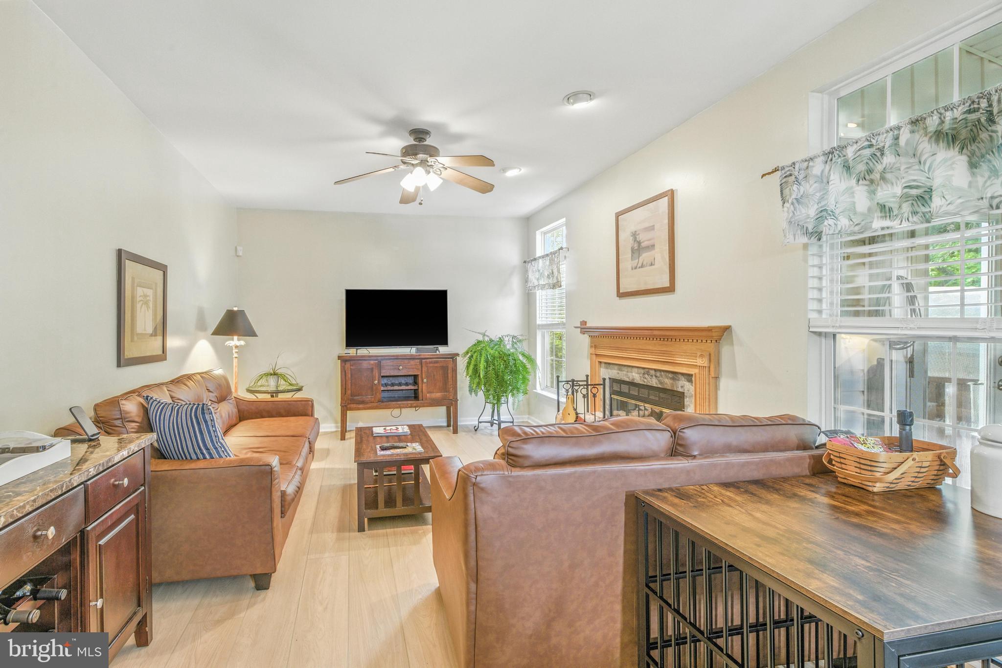 463 Preakness Run Newark, DE 19702 - Photo 14 of 32 a living room with fireplace furniture and a flat screen tv