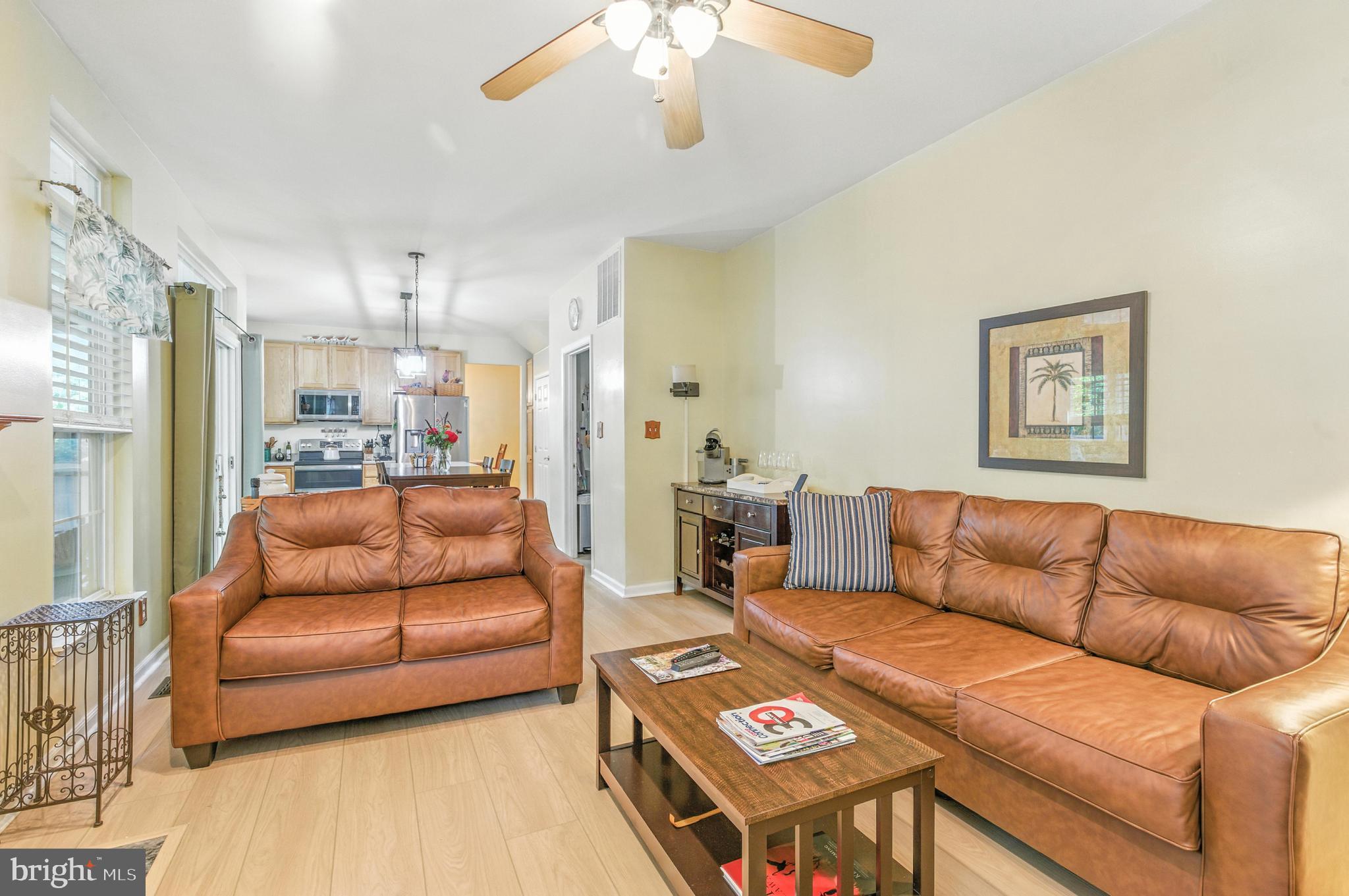 463 Preakness Run Newark, DE 19702 - Photo 15 of 32 a living room with furniture and a chandelier