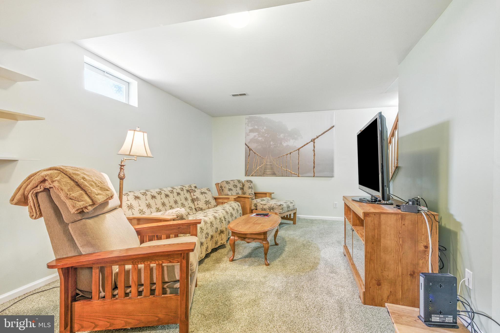 463 Preakness Run Newark, DE 19702 - Photo 25 of 32 a living room with furniture and flat screen tv
