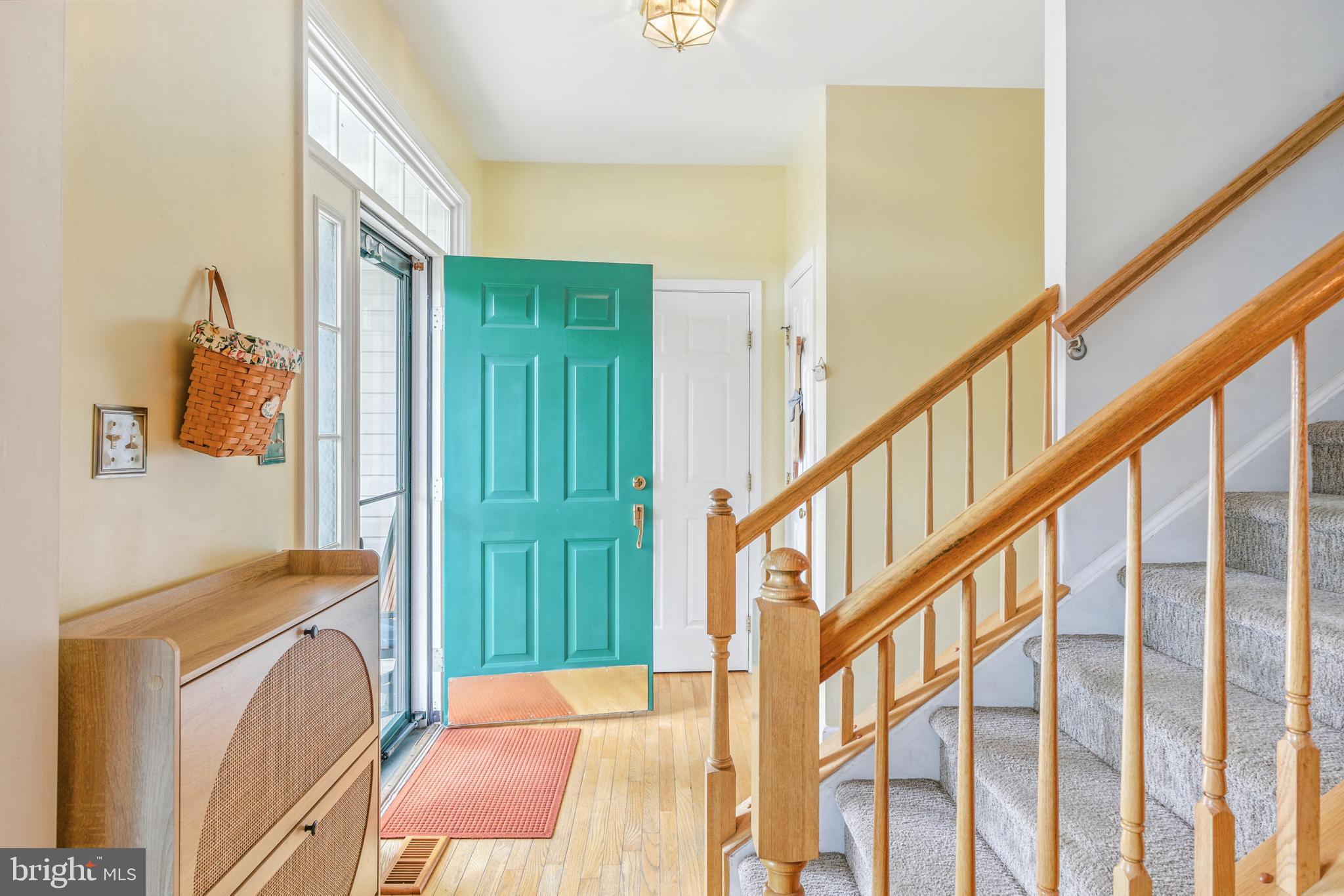 463 Preakness Run Newark, DE 19702 - Photo 6 of 32 a bedroom with a bed and a large window with wooden floor