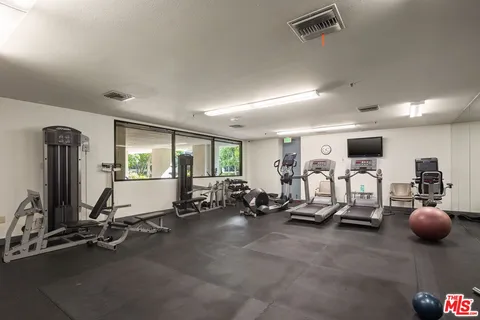a view of a room with gym equipment