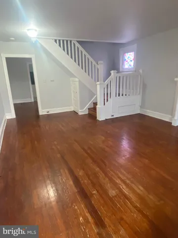 a view of staircase with white walls and stairs