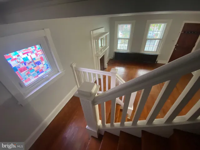 a view of an entryway with wooden floor