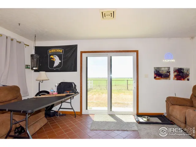 a workspace with furniture and window