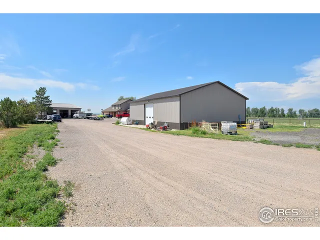 a picture of a road and a building in the background