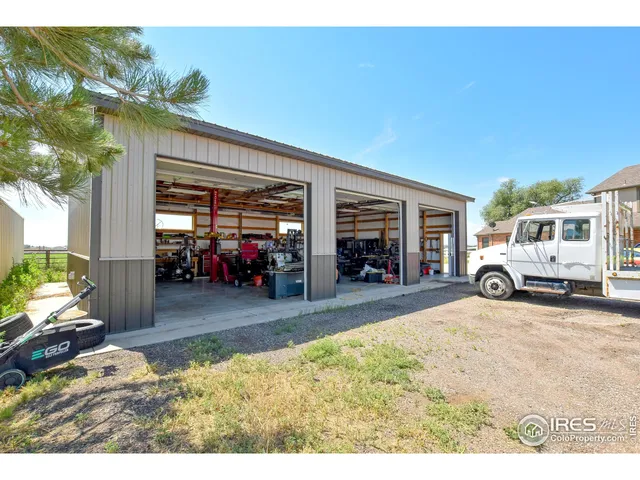 a view of a livingroom with furniture and a porch