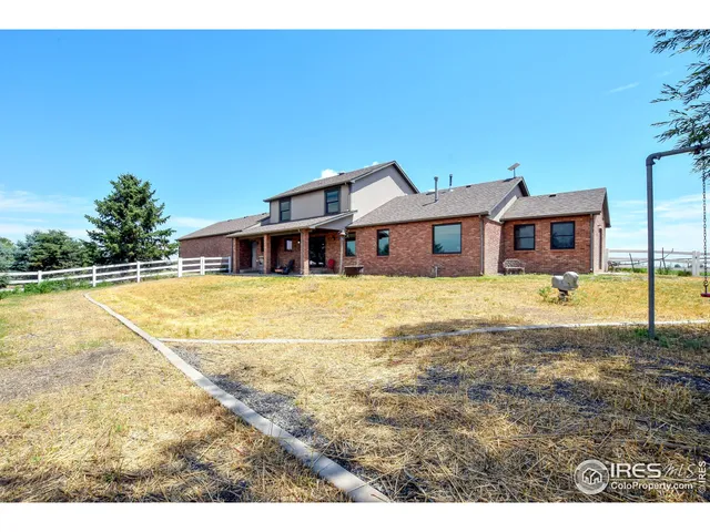a view of a backyard with potted plants