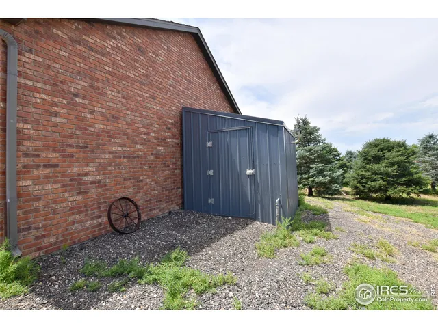a view of a big yard with an trees