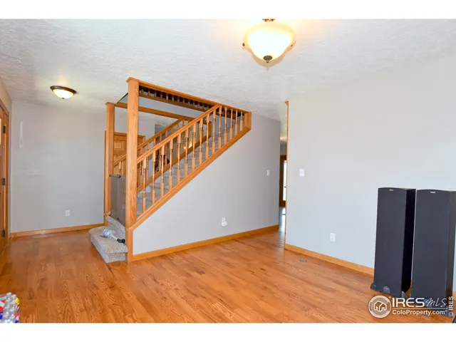 a view of an entryway with wooden floor