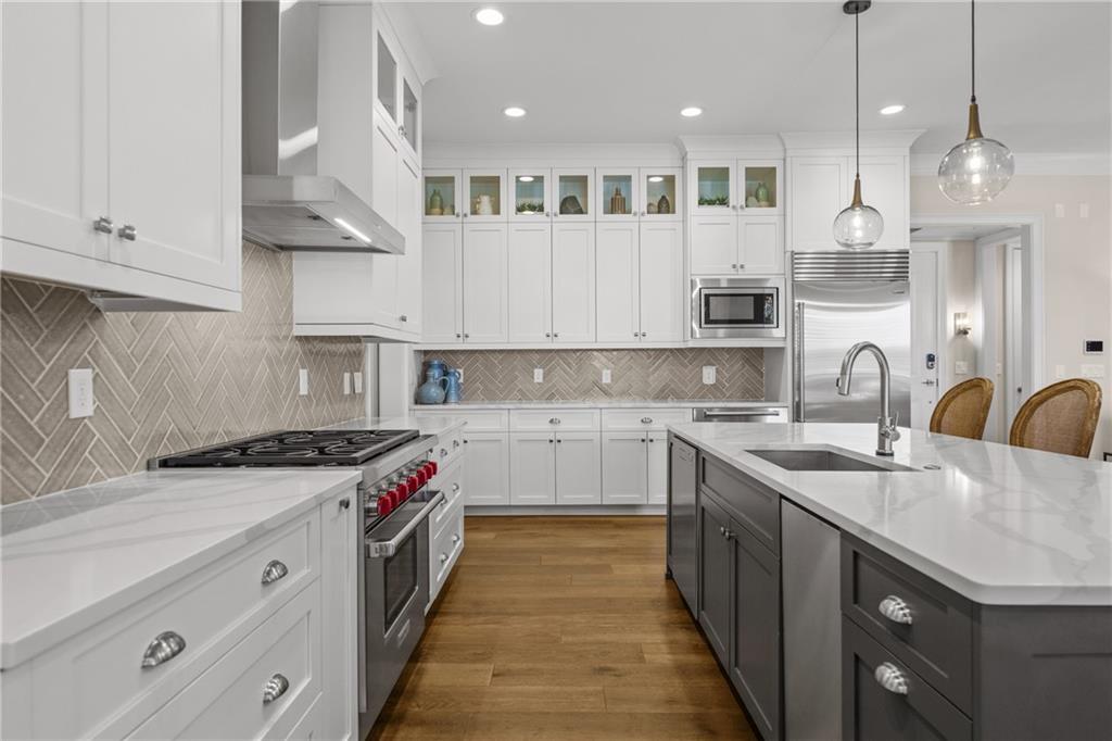 50 Canton Street, Unit 307 Alpharetta, GA 30009 - Photo 11 of 56 a kitchen with stainless steel appliances granite countertop a sink a stove and a refrigerator