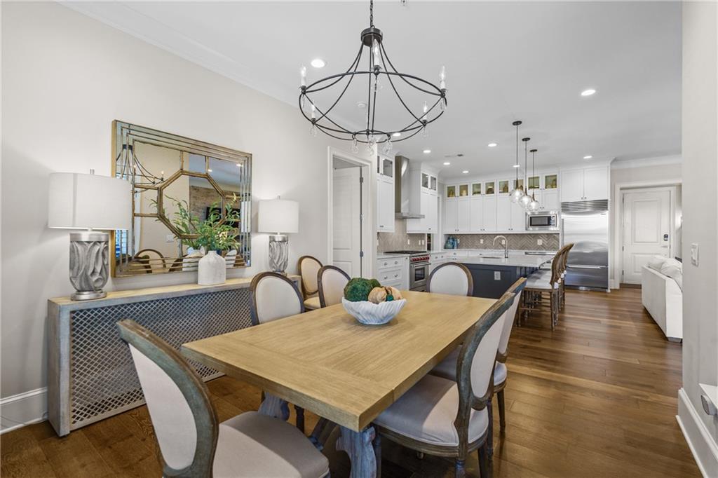 50 Canton Street, Unit 307 Alpharetta, GA 30009 - Photo 13 of 56 a view of a dining room with furniture window and wooden floor