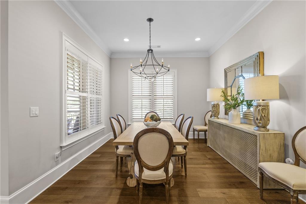 50 Canton Street, Unit 307 Alpharetta, GA 30009 - Photo 14 of 56 a dining room with furniture a chandelier and wooden floor