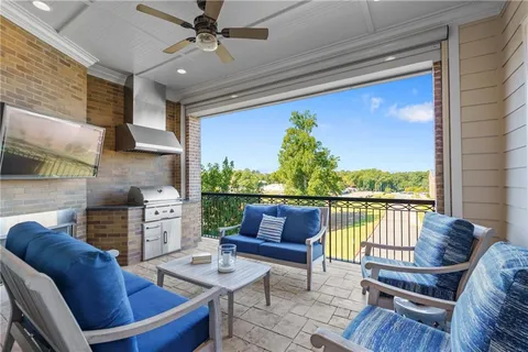 a living room with fireplace furniture and a flat screen tv
