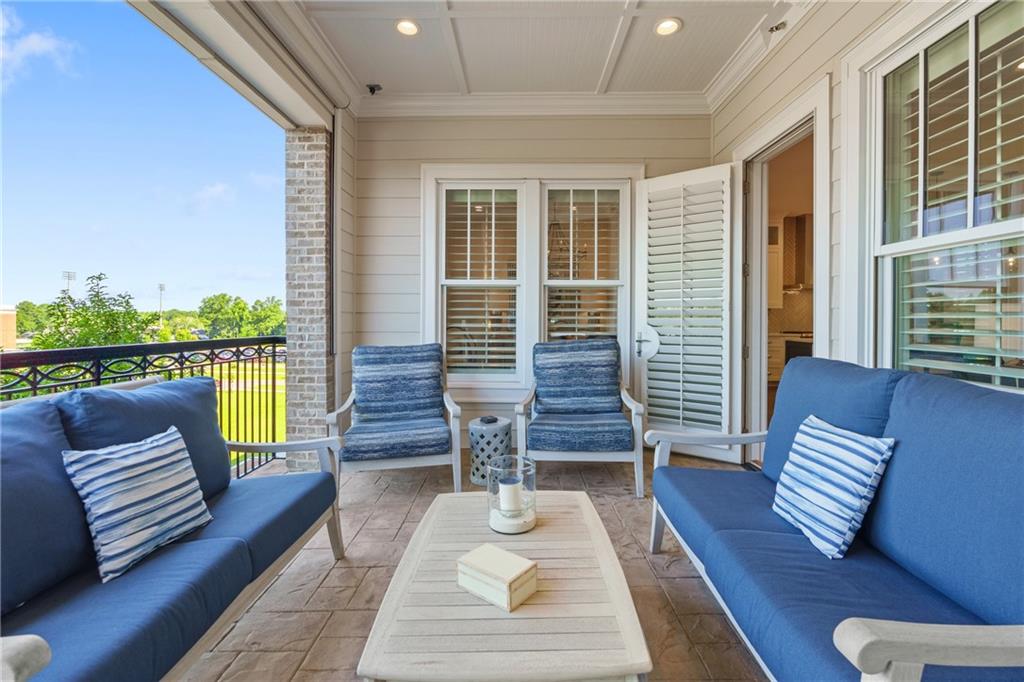 50 Canton Street, Unit 307 Alpharetta, GA 30009 - Photo 20 of 56 a view of outdoor living space with furniture and wooden floor