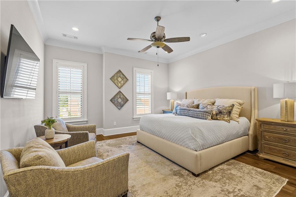 50 Canton Street, Unit 307 Alpharetta, GA 30009 - Photo 21 of 56 a spacious bedroom with a bed couch and windows