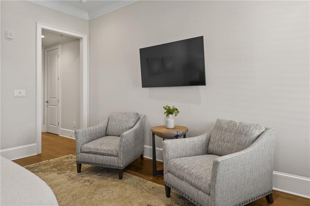 50 Canton Street, Unit 307 Alpharetta, GA 30009 - Photo 22 of 56 a living room with furniture and a flat screen tv