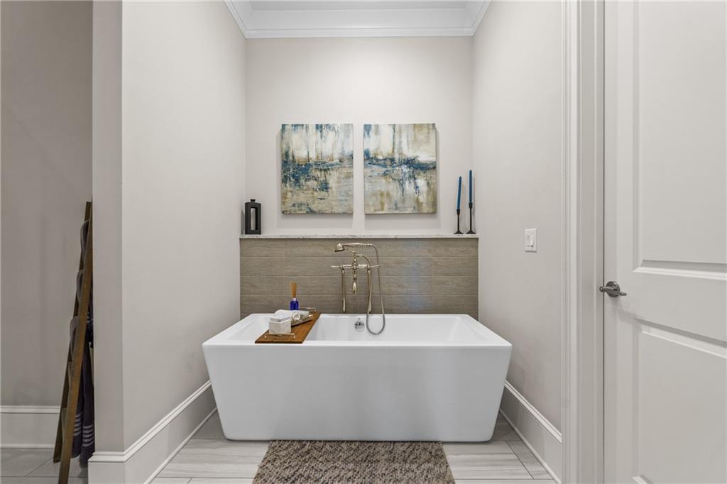 50 Canton Street, Unit 307 Alpharetta, GA 30009 - Photo 23 of 56 a white bath tub sitting in a bathroom