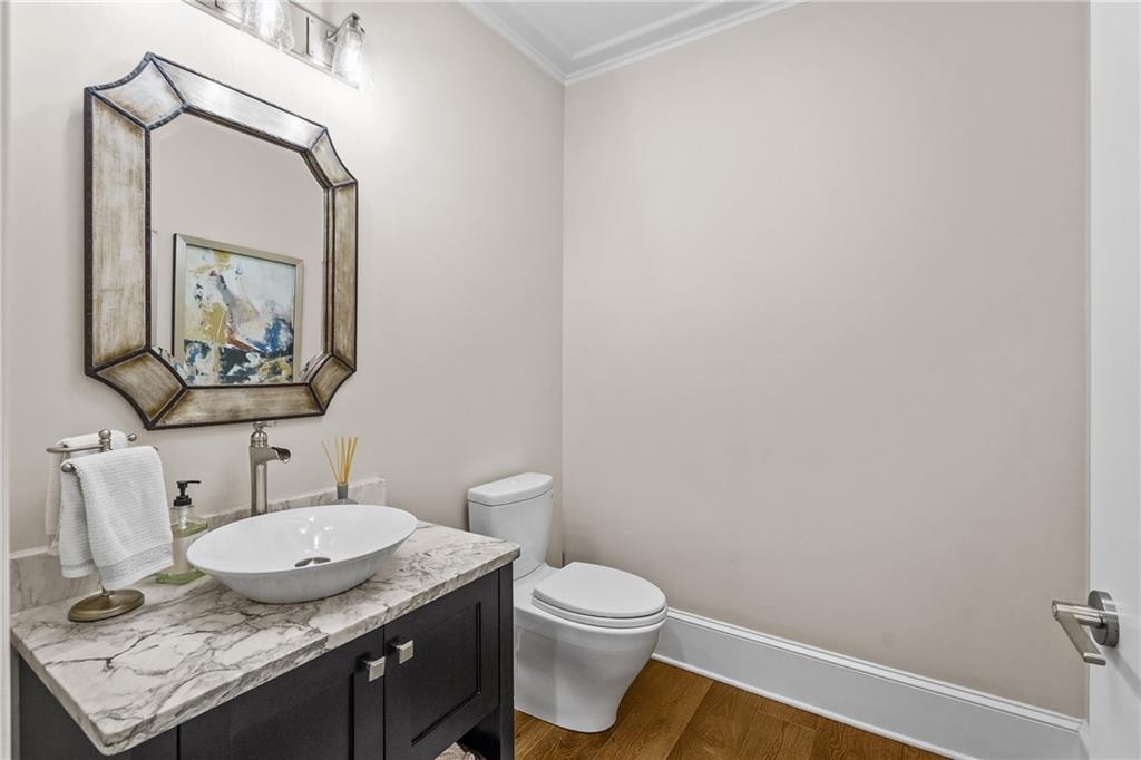 50 Canton Street, Unit 307 Alpharetta, GA 30009 - Photo 30 of 56 a bathroom with a granite countertop sink and a mirror