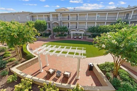 a front view of a house with a yard table and chairs