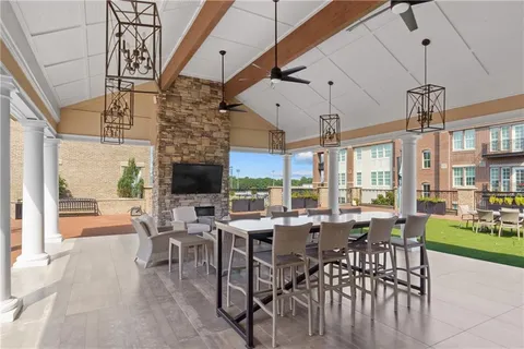 an aerial view of a house with a yard and a fountain