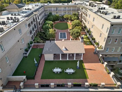 a view of a brick buildings with many windows