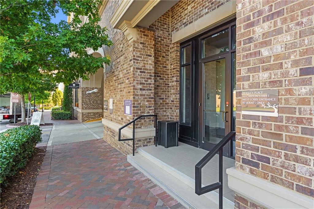 50 Canton Street, Unit 307 Alpharetta, GA 30009 - Photo 43 of 56 a view of a patio with table and chairs and potted plants