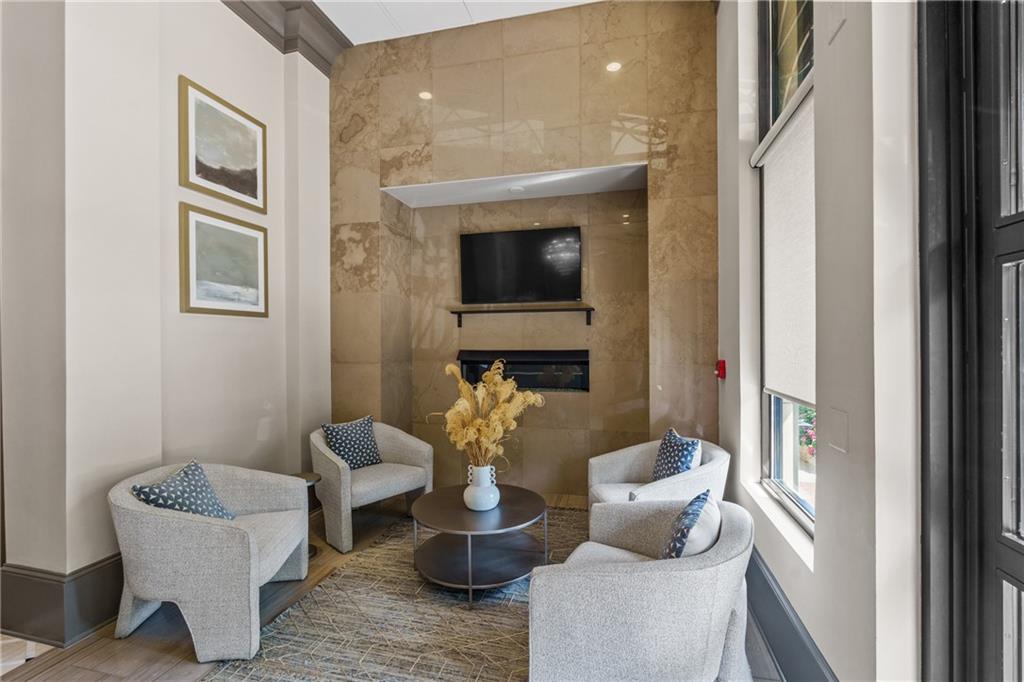 50 Canton Street, Unit 307 Alpharetta, GA 30009 - Photo 45 of 56 a living room with furniture and a fireplace