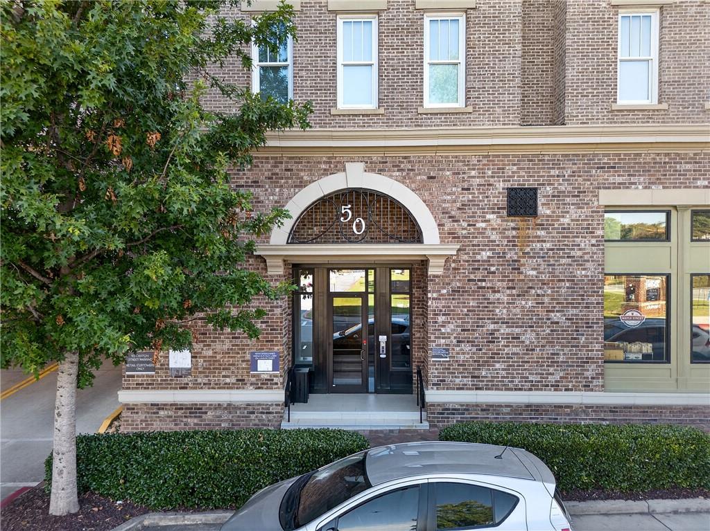 50 Canton Street, Unit 307 Alpharetta, GA 30009 - Photo 53 of 56 a front view of a house with a garden