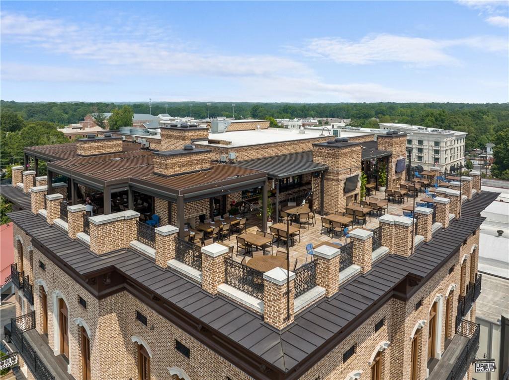 50 Canton Street, Unit 307 Alpharetta, GA 30009 - Photo 56 of 56 a view of a terrace with sitting area