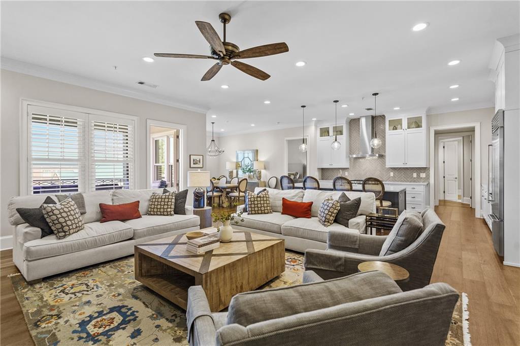 50 Canton Street, Unit 307 Alpharetta, GA 30009 - Photo 6 of 56 a living room with furniture wooden floor and a window