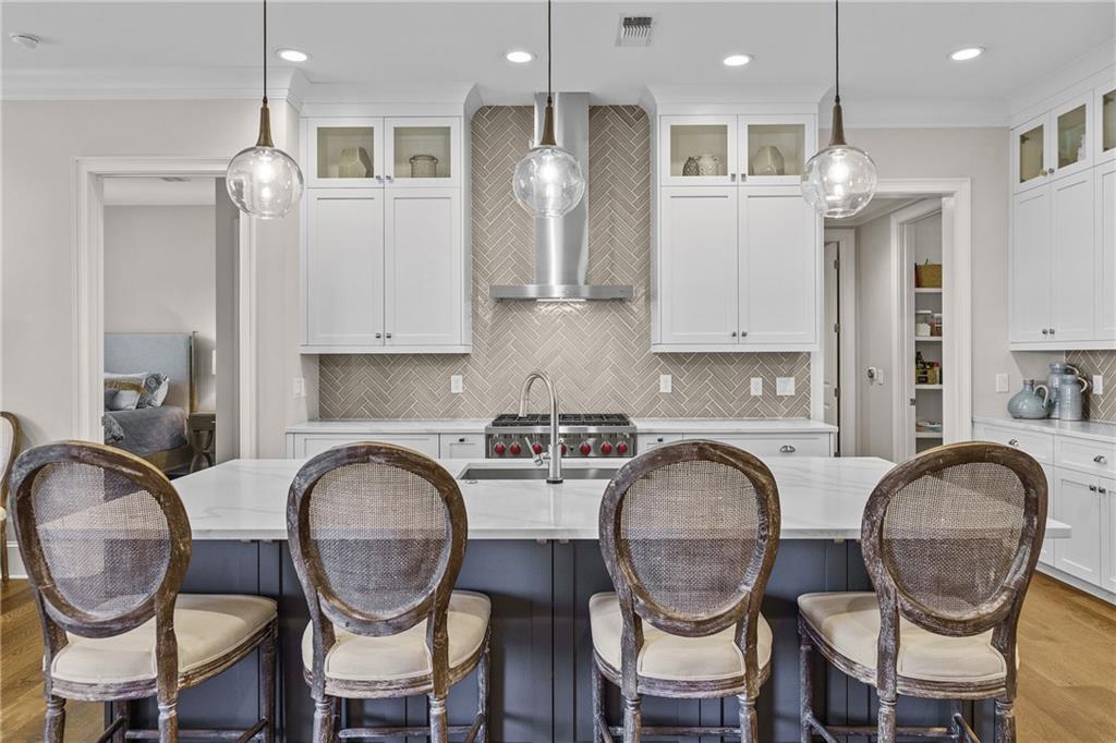 50 Canton Street, Unit 307 Alpharetta, GA 30009 - Photo 8 of 56 a kitchen with stainless steel appliances granite countertop a dining table chairs and kitchen view