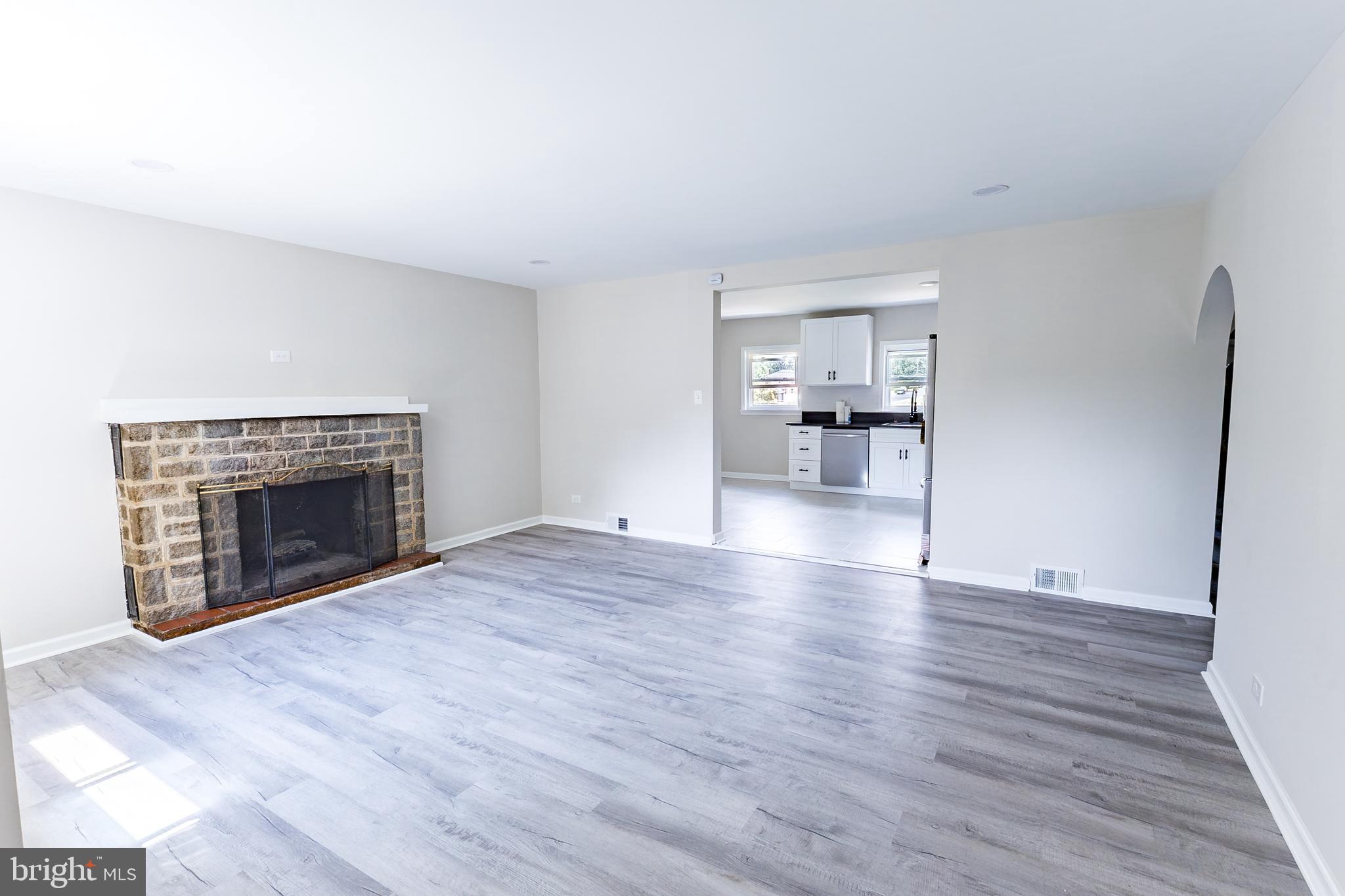 Elliot Avenue Bethlehem, PA 18018 - Photo 20 of 39 a view of empty room with wooden floor and fireplace