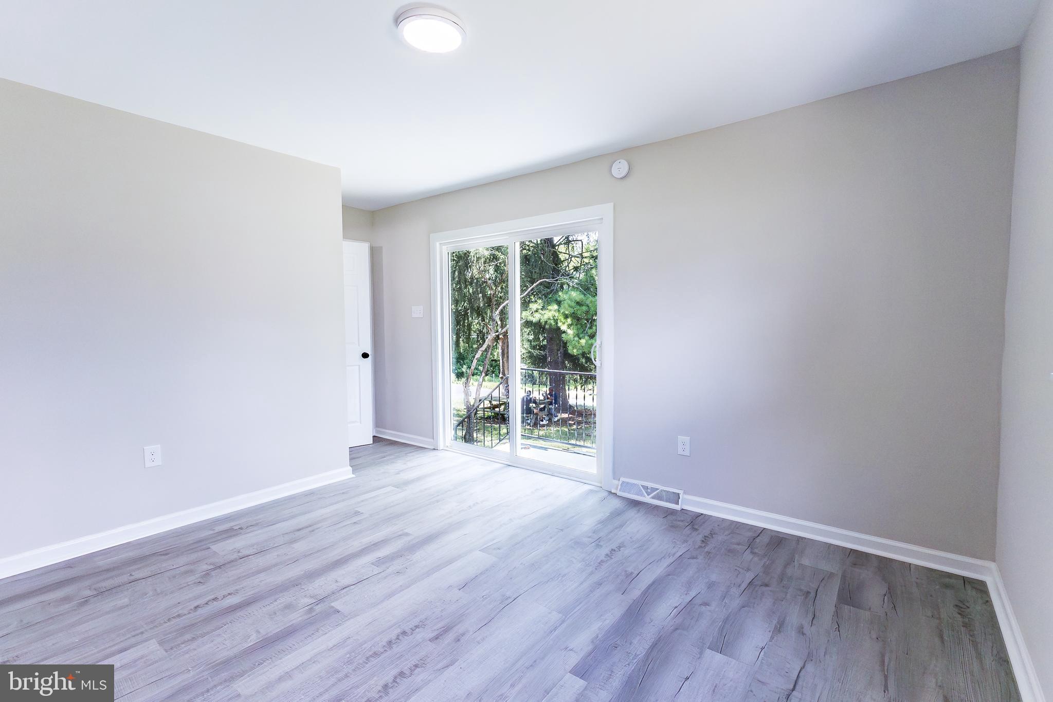 Elliot Avenue Bethlehem, PA 18018 - Photo 22 of 39 an empty room with wooden floor and windows