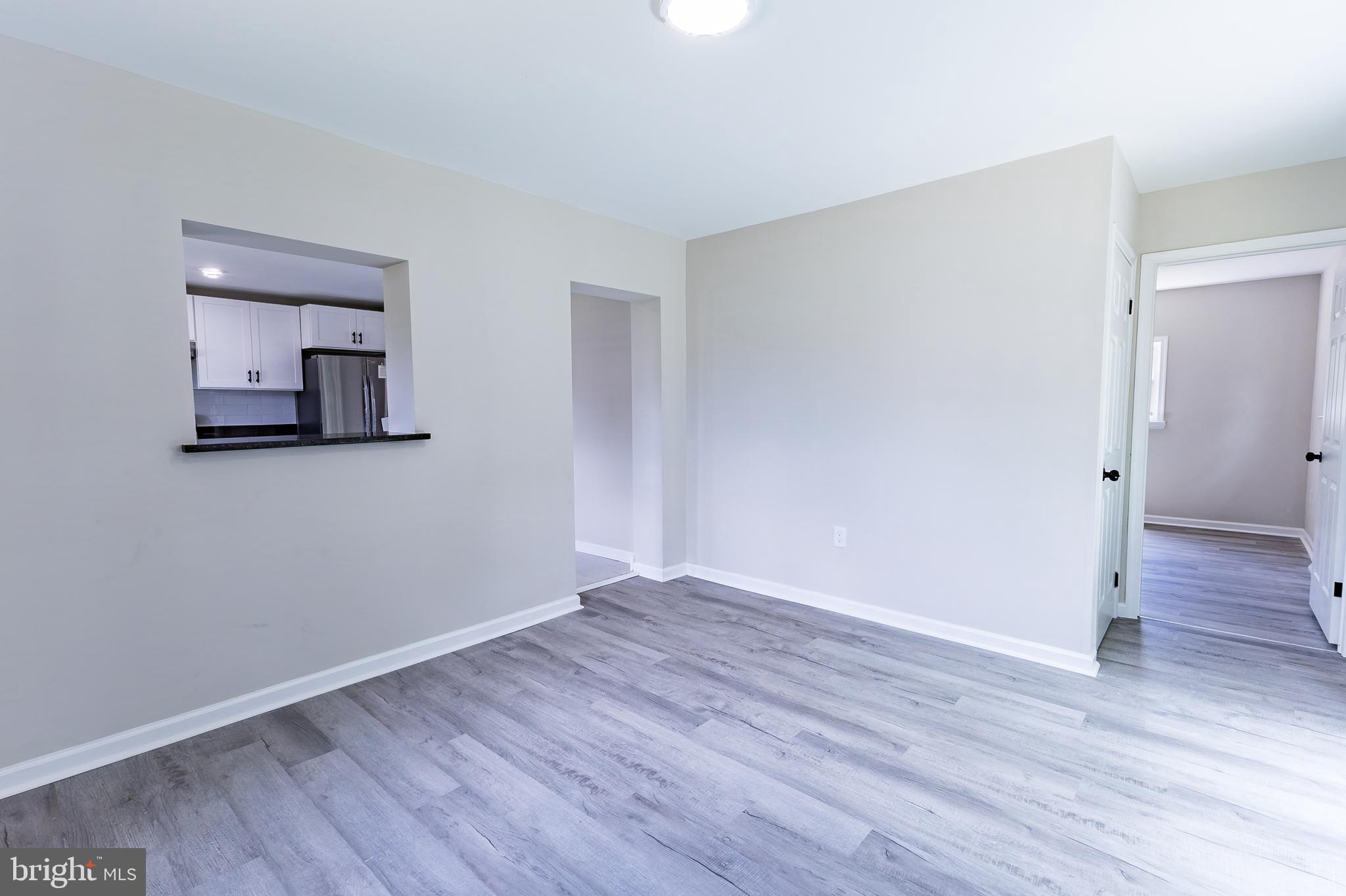 Elliot Avenue Bethlehem, PA 18018 - Photo 23 of 39 a view of a room with wooden floor and a mirror