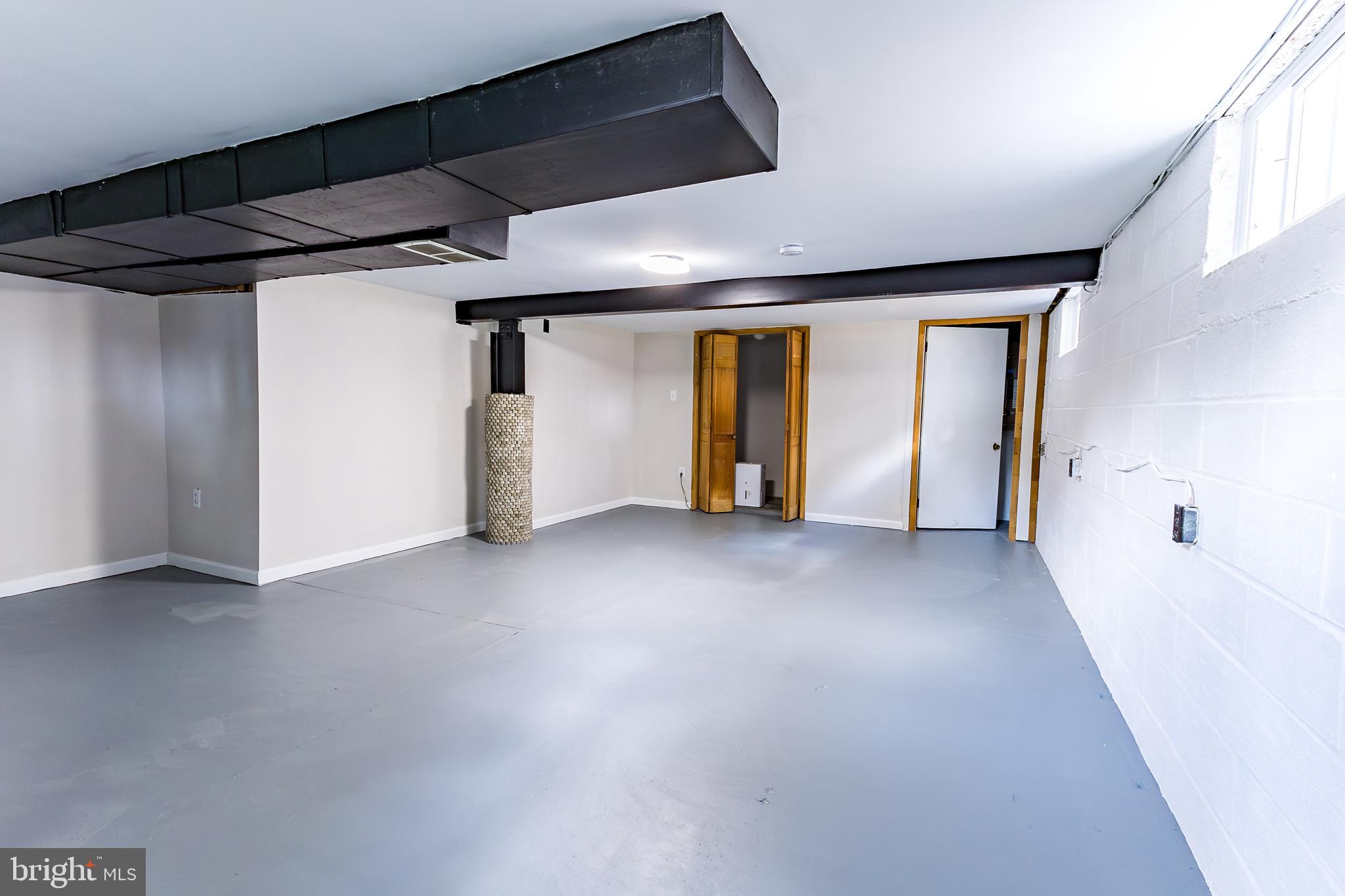 Elliot Avenue Bethlehem, PA 18018 - Photo 35 of 39 a view of an empty room with wooden floor and a window