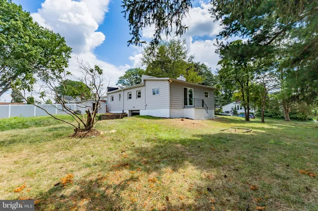 a house with swimming pool in front of it