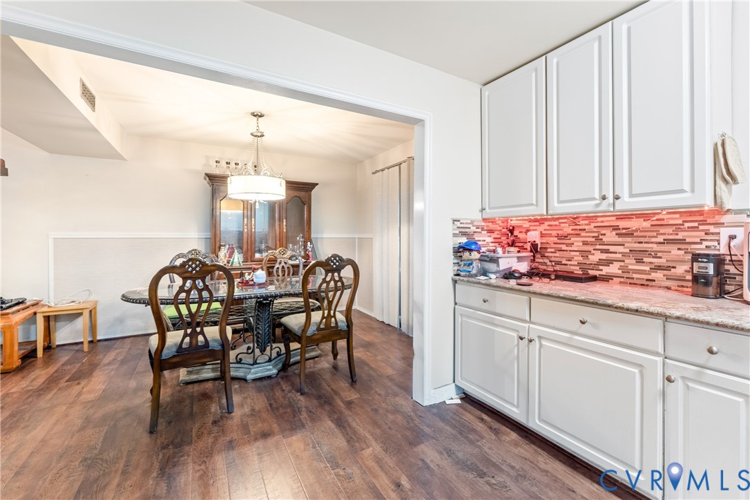 10709 Solaris Court Chesterfield, VA 23832 - Photo 12 of 34 a view of a dining room with furniture and wooden floor