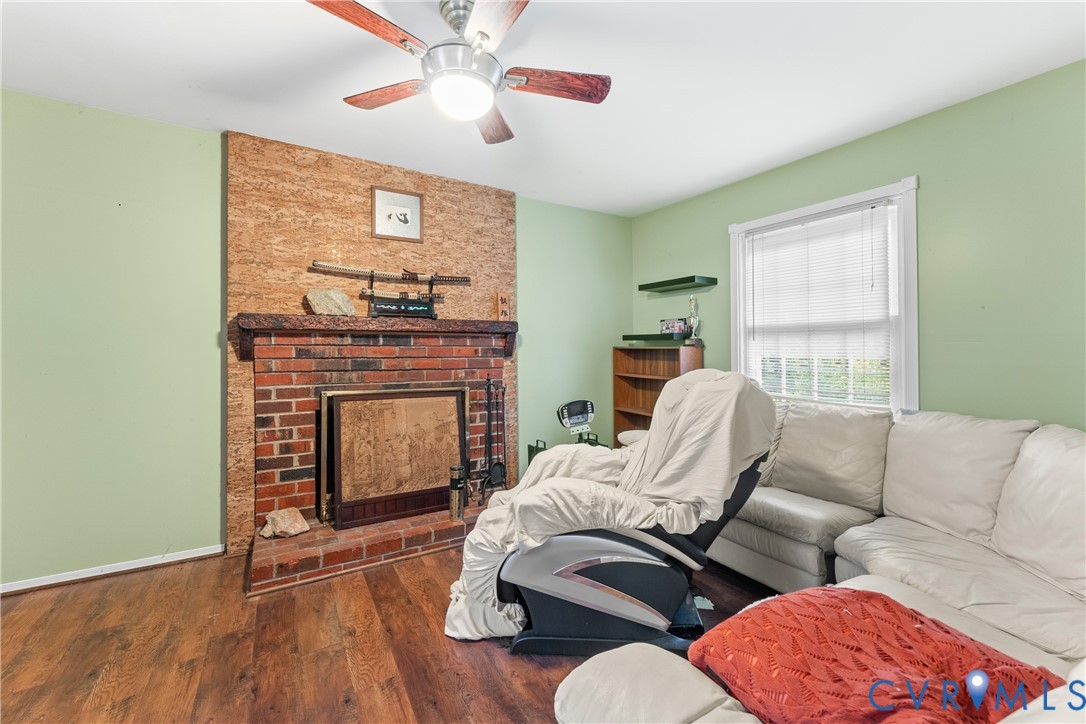 10709 Solaris Court Chesterfield, VA 23832 - Photo 17 of 34 a living room with furniture and a fireplace