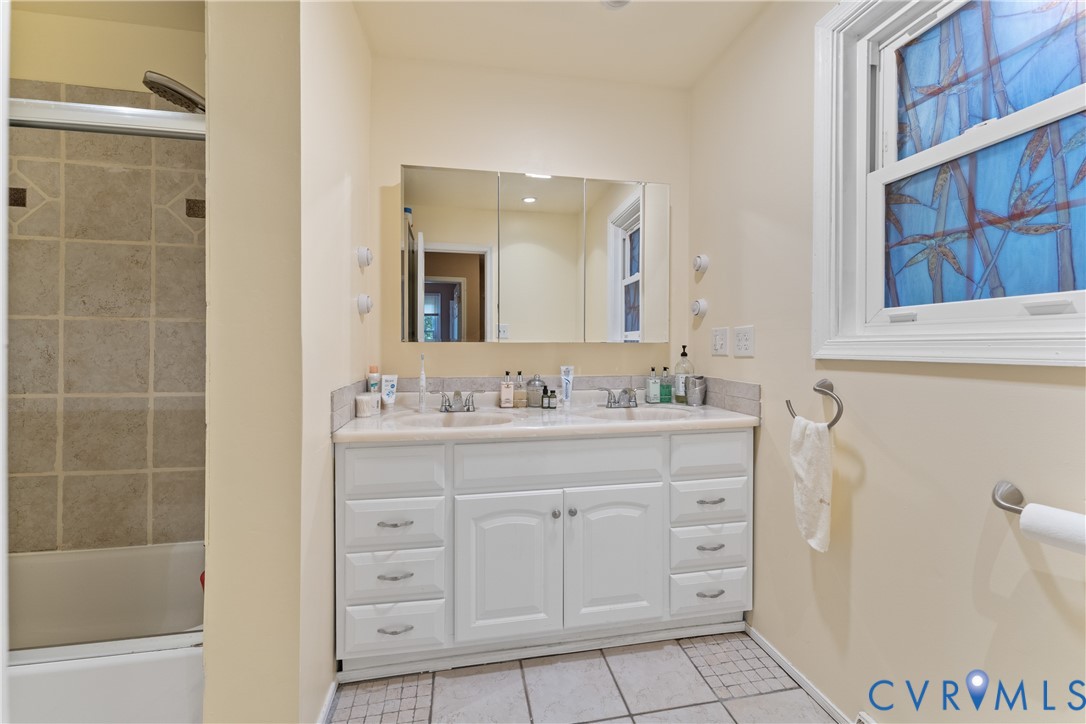 10709 Solaris Court Chesterfield, VA 23832 - Photo 18 of 34 a bathroom with a sink a vanity and a mirror