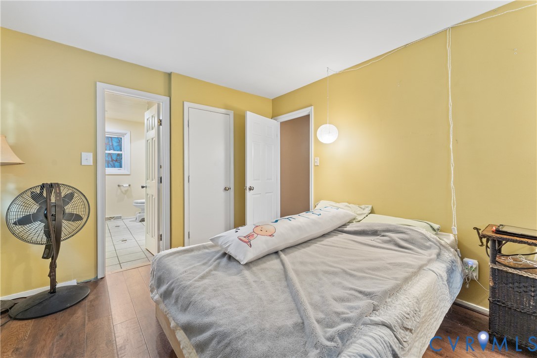 10709 Solaris Court Chesterfield, VA 23832 - Photo 21 of 34 a bedroom with a bed a mirror and a window