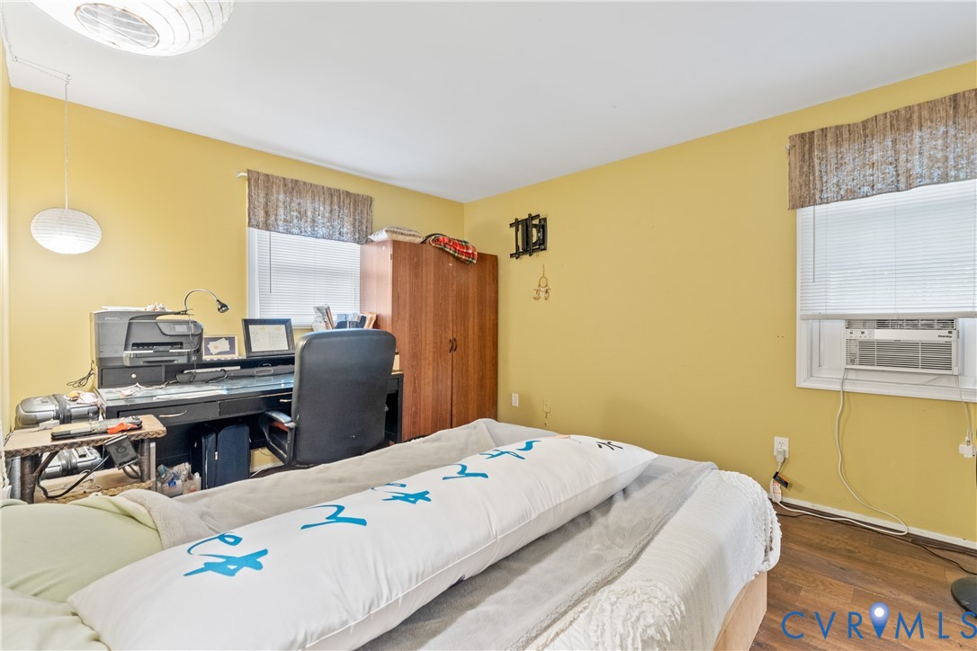 10709 Solaris Court Chesterfield, VA 23832 - Photo 22 of 34 a bedroom with a bed and wooden floor