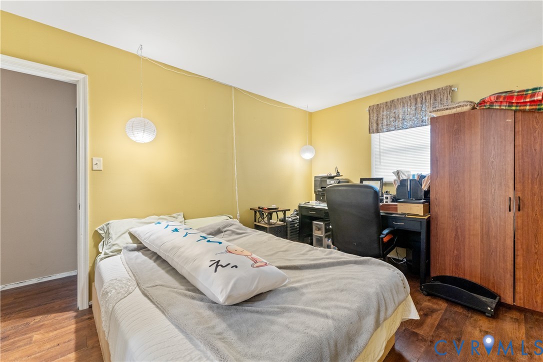 10709 Solaris Court Chesterfield, VA 23832 - Photo 23 of 34 a bedroom with a bed and wooden floor