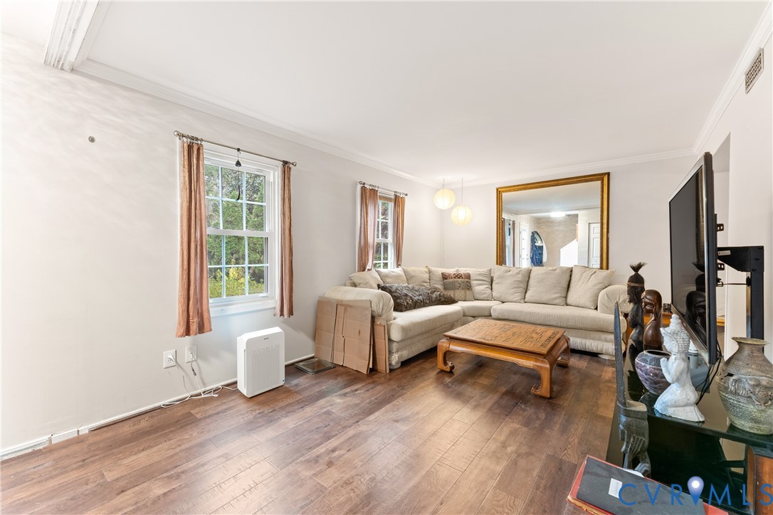 10709 Solaris Court Chesterfield, VA 23832 - Photo 4 of 34 a living room with furniture a flat screen tv and a window